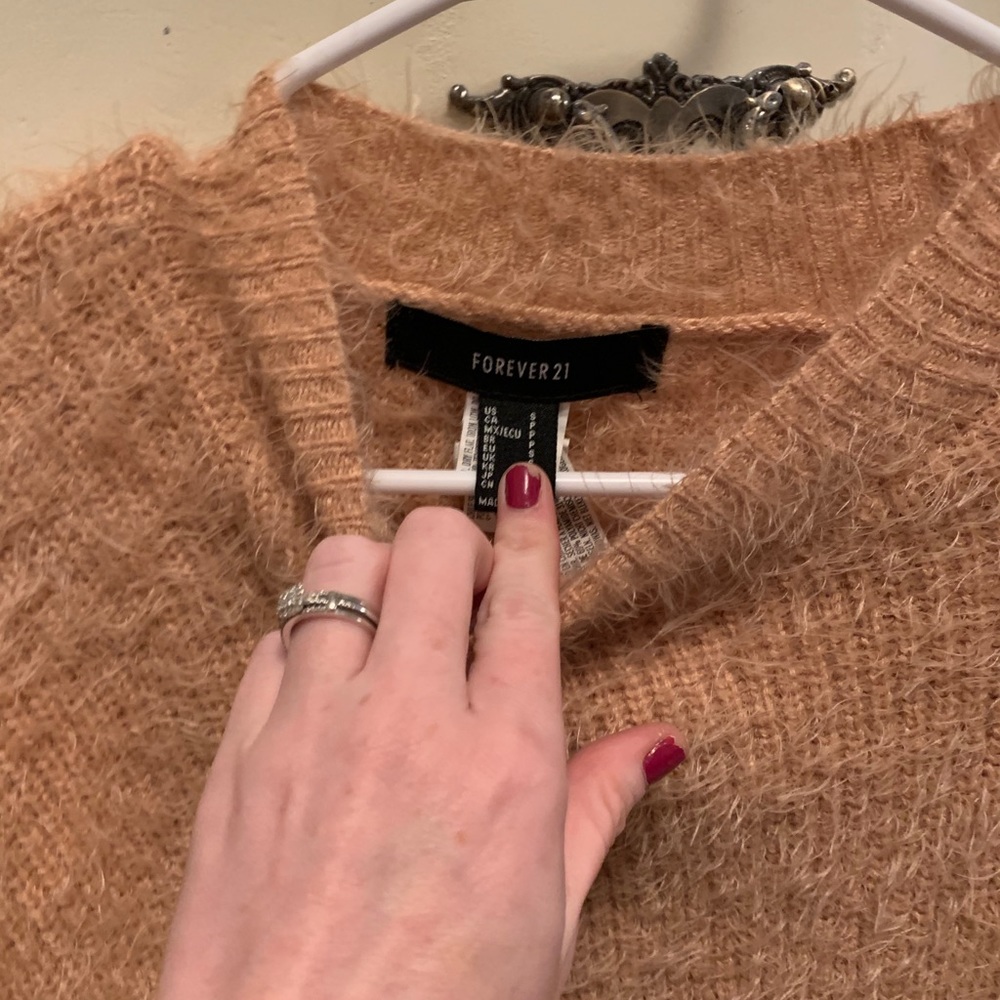 Super cute sweater with tie sides